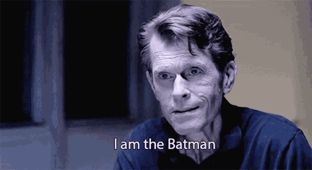 an older man says i am the batman in a black and white photo