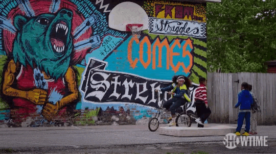 a mural on the side of a building that says struggle comes strength