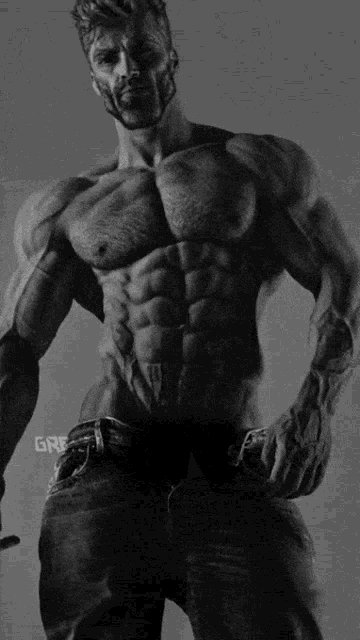 a black and white photo of a muscular man with the word gre on the bottom