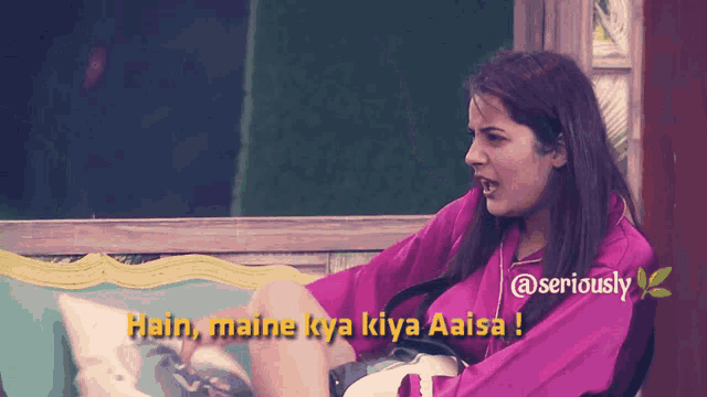 a woman in a purple shirt says hain maine kya kiya aisa