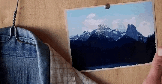 a picture of a mountain hanging on a wall