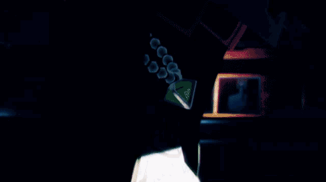 a close up of a person wearing a helmet with a triangle on it