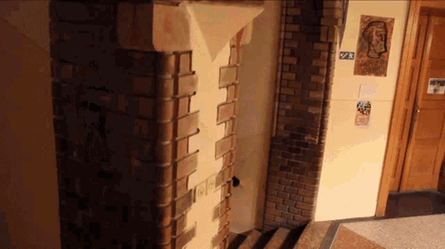 a brick wall with a sign that says 23 on it