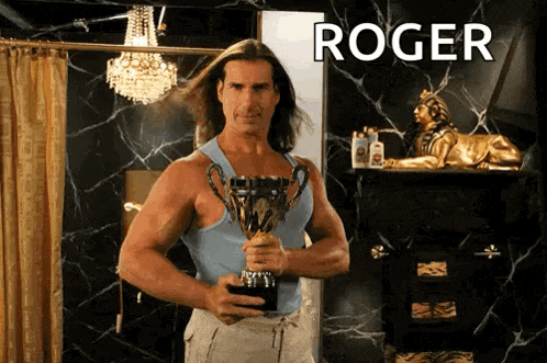 a man holding a trophy with the name roger written above him
