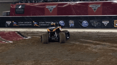 a monster jam sign is behind a monster truck