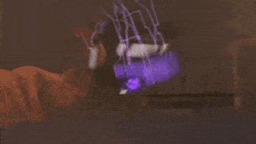 a large explosion in a dark room with a lot of smoke coming out of it