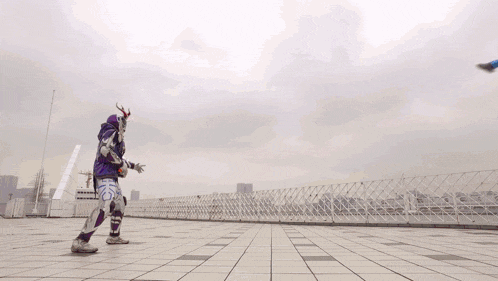 a superhero is fighting another superhero on a rooftop
