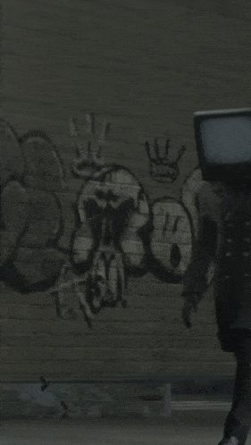 a person standing in front of a wall that has graffiti on it that says ' rio '