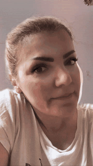 a close up of a woman 's face with the number 3 on the bottom right
