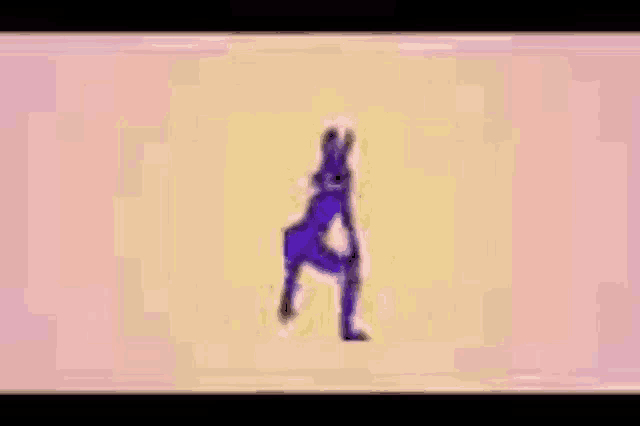 a person is dancing on a pink and yellow background .