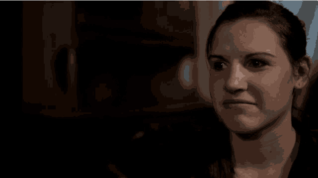 a woman making a funny face with her mouth open