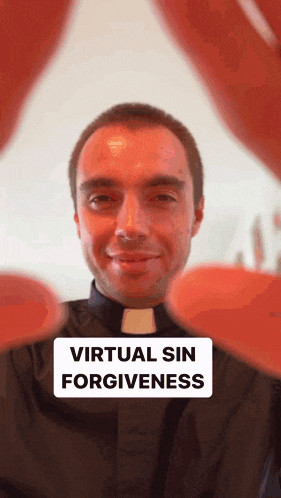a man in a black shirt with a collar that has the words virtual sin forgiveness on it