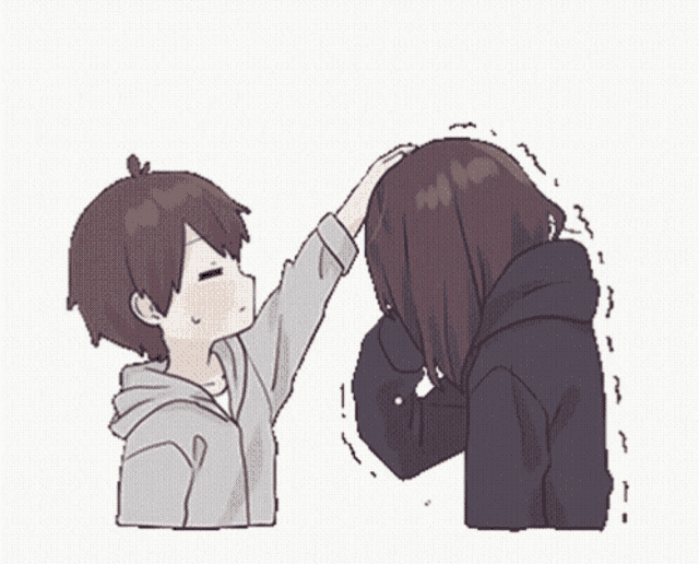 a boy and a girl are touching each other 's foreheads .
