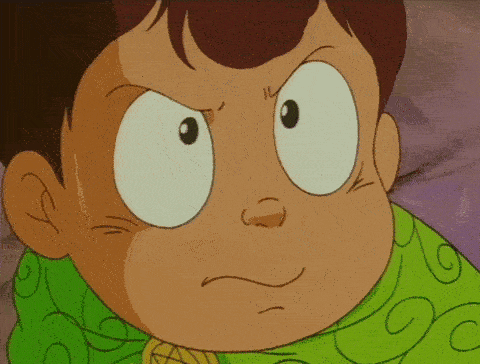 a close up of a cartoon character 's face with a green shirt