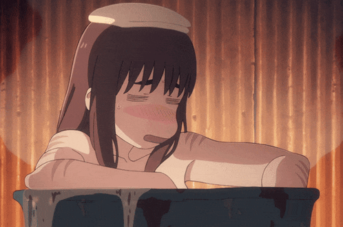 a girl in a bathtub with her eyes closed