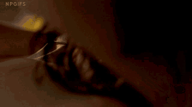 a close up of a person 's neck with npgifs written on the bottom right