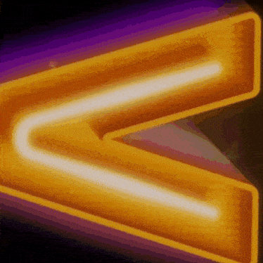a neon sign with the letter v lit up