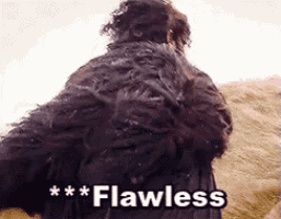 a man in a fur coat is standing next to a lion and says " flawless " on the bottom