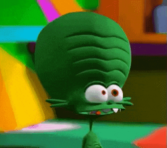 a green cartoon character with a large head