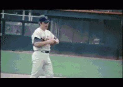 a man in a dodgers uniform stands on a field