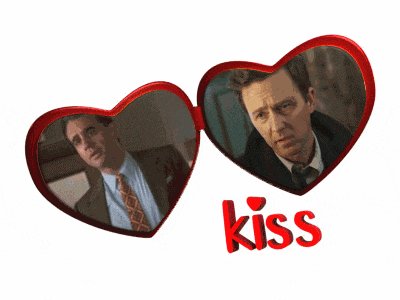 a picture of two men with the word kiss in red