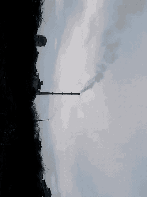 smoke coming out of a chimney in the sky