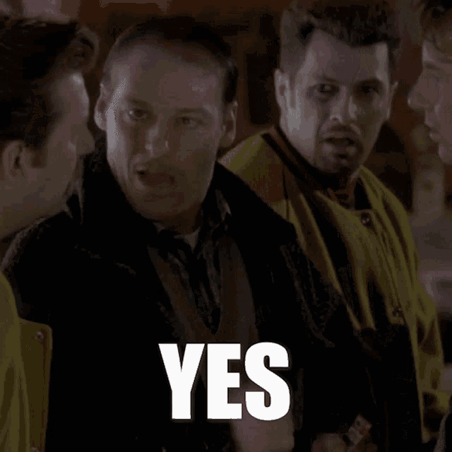 a man in a yellow jacket says " on est en business " in a foreign language