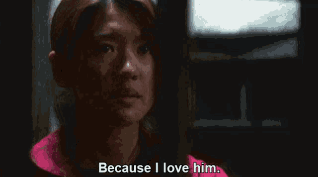 a woman is saying because i love him in a dark room