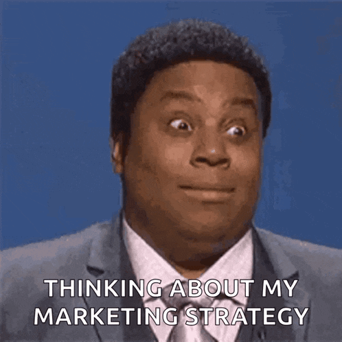 a man in a suit and tie is talking about his marketing strategy .