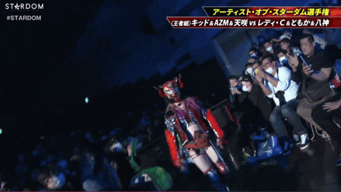 a boxing match is being shown on a screen with a stardom logo