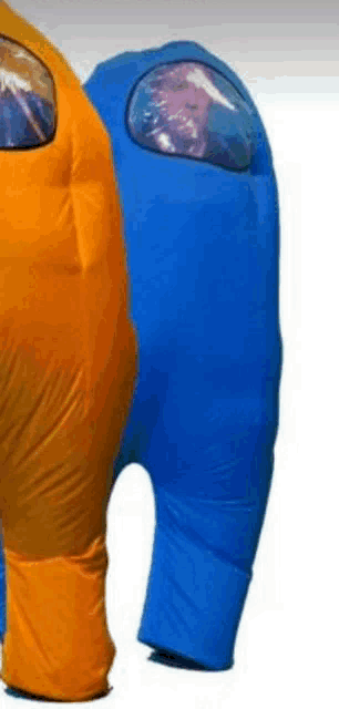 a blue and an orange among us inflatable costume are standing next to each other .