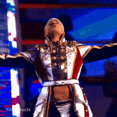 a man with his arms outstretched is wearing a costume that says tiff luv24 on the bottom