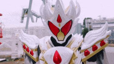 a white and red costume with a crown on it