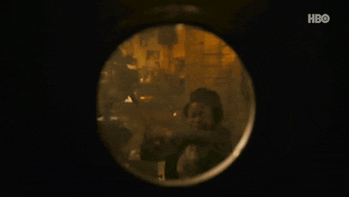 a close up of a broken glass window with a hbo logo in the corner