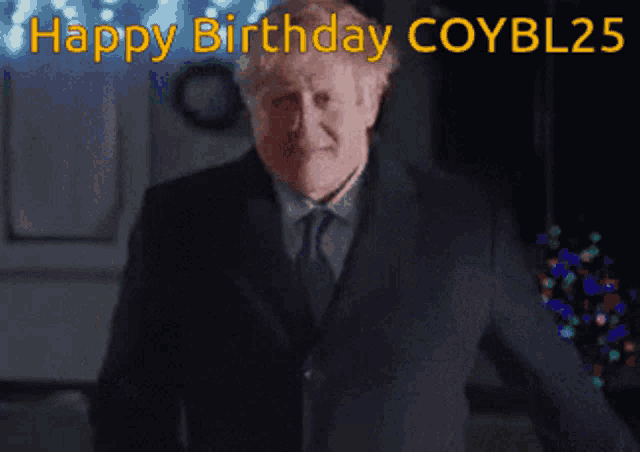 a man in a suit and tie is saying happy birthday coybl25