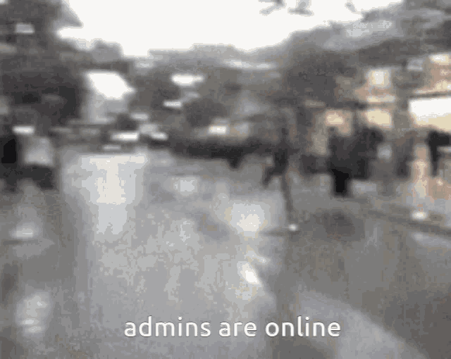 a blurry picture of a city street with the words admins are online