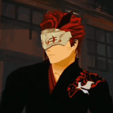 a man with red hair is wearing a mask on his eyes