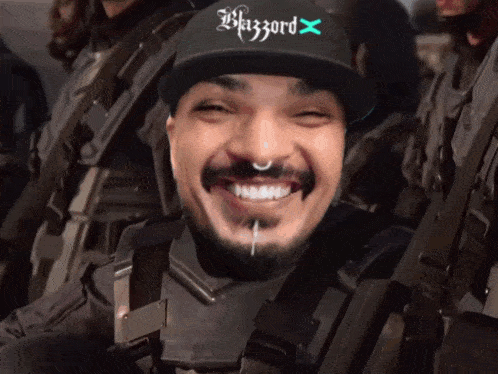 a man wearing a black hat that says blizzard x
