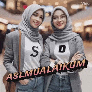 two women wearing hijabs and shirts with the letter s and d