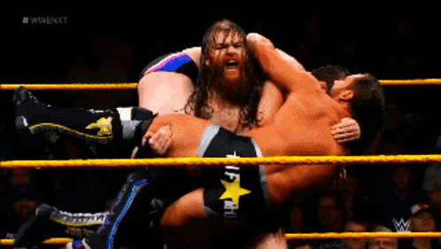wrestlers in a wrestling ring with the words #wwenxt on the bottom left