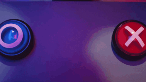 a person is pressing a button with a red light on it