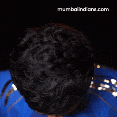 a close up of a man 's head with the website mumbaiindians.com written on the bottom