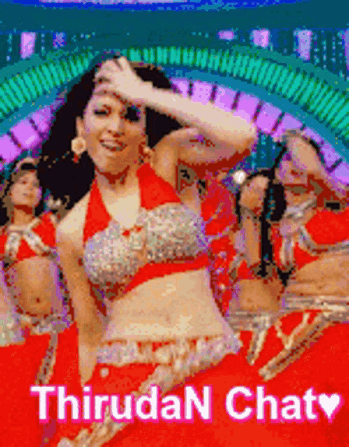 a group of women are dancing in front of a sign that says thiruda n chaty