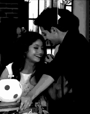 a black and white photo of a man and a woman with pxo written on the bottom