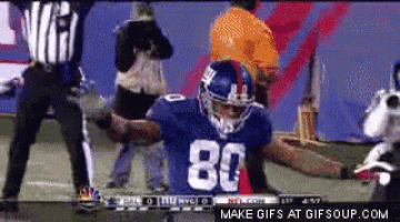a football player with the number 80 on his jersey is celebrating