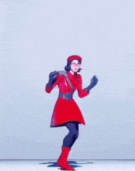 a woman in a red coat and hat is dancing