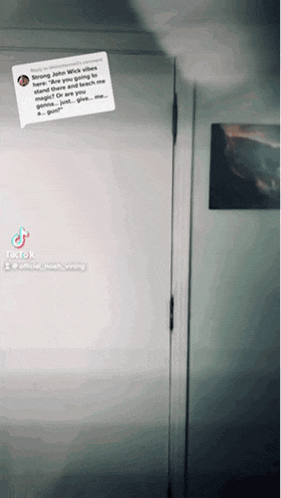 a tiktok video of a person standing in a doorway