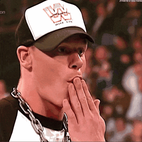 a man wearing a hat that says world heavyweights on it