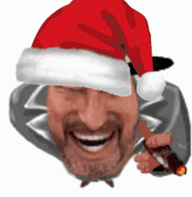 a man wearing a santa hat is smiling and holding a cigarette