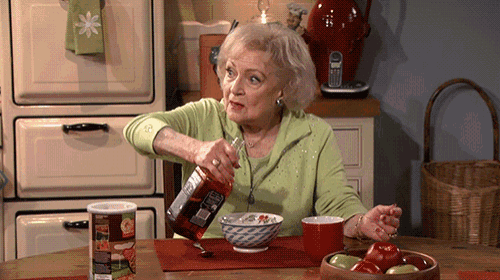 an elderly woman pours a drink into a bowl
